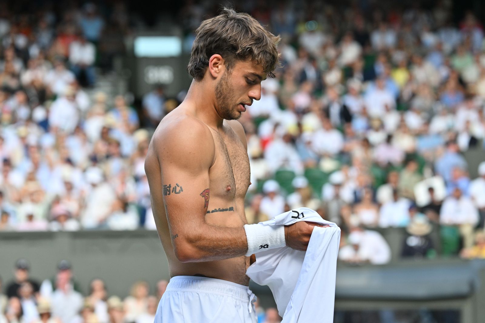 Flavio Cobolli Wimbledon tennis context Flavio Cobolli in a contextual photograph: Wimbledon tennis context; not tattoo evidence