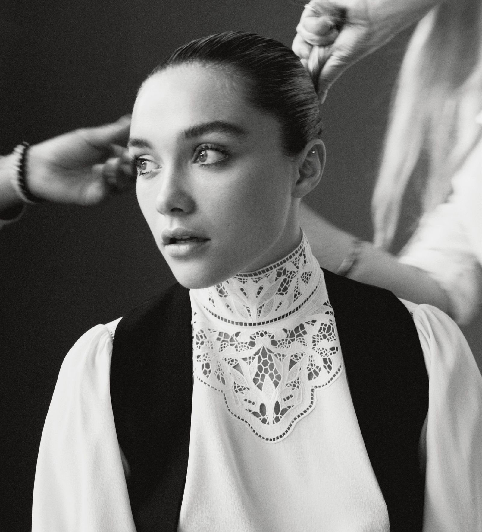 Florence Pugh in a contextual photograph: behind-the-scenes contextual portrait, not tattoo evidence; not tattoo evidence