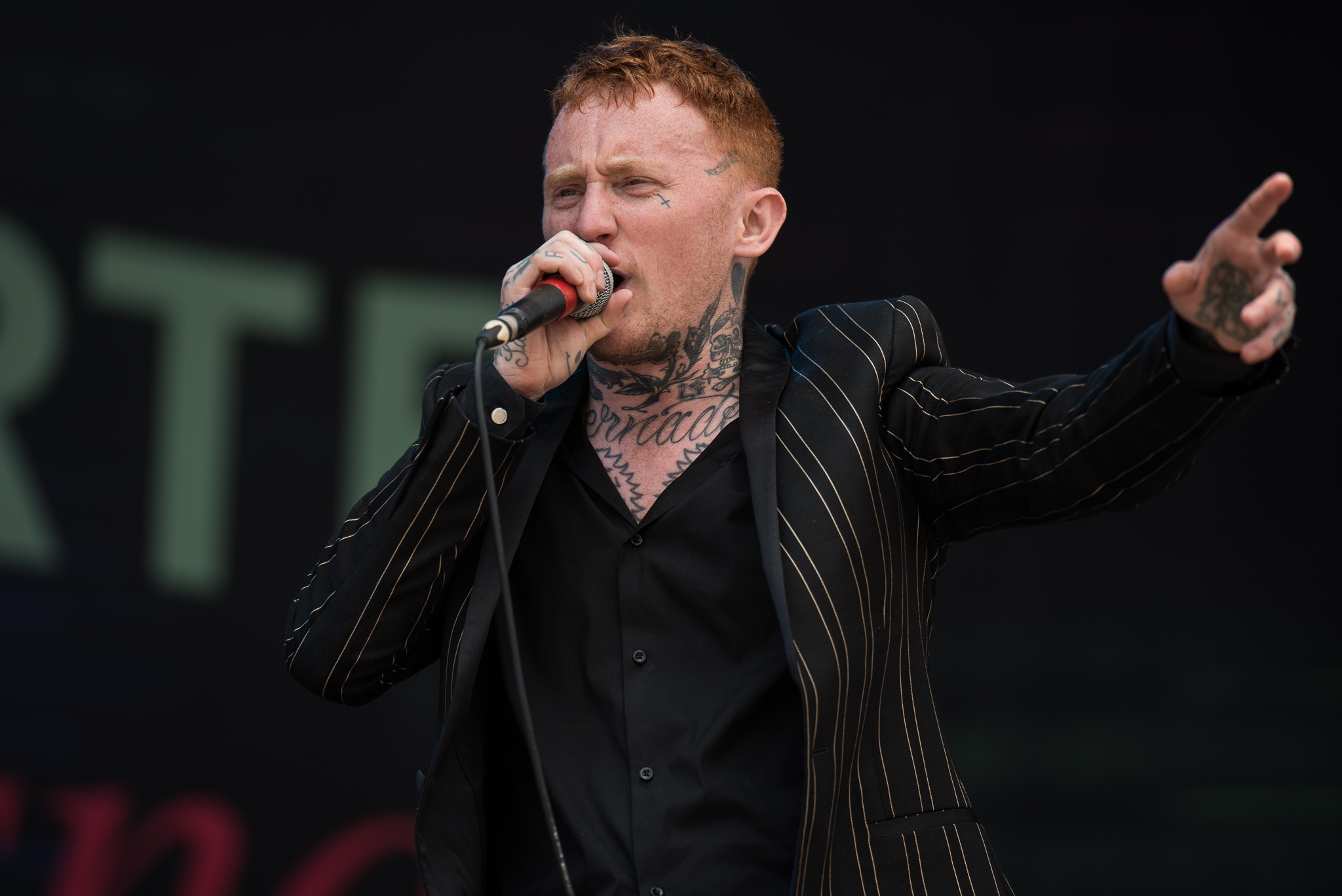 Frank Carter arm tattoos while performing