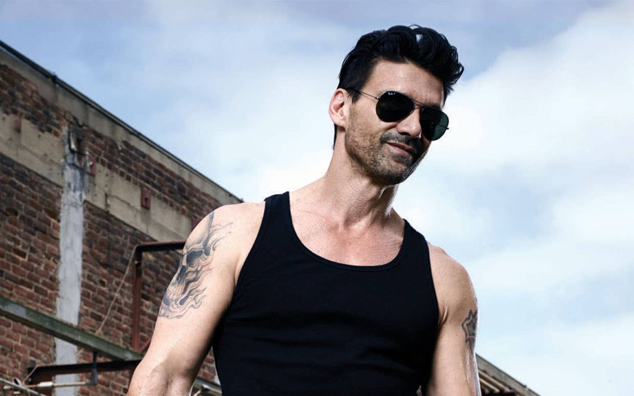 Frank Grillo tattoos: high-resolution athletic portrait showing how multiple arm tattoos sit on the body