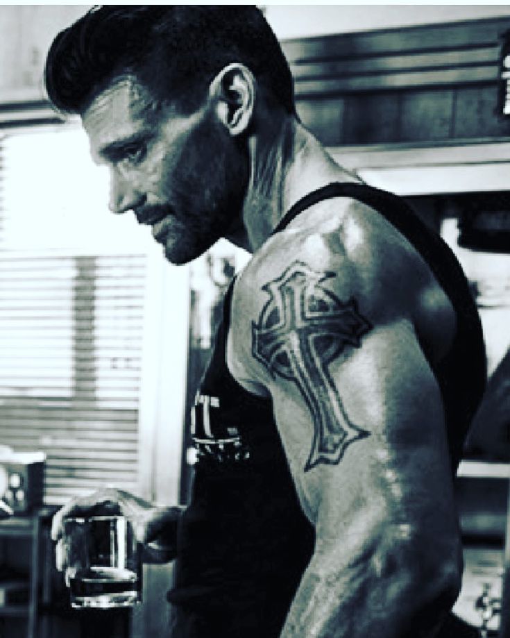 Frank Grillo tattoos: high-resolution portrait showing the large cross tattoo on the upper arm