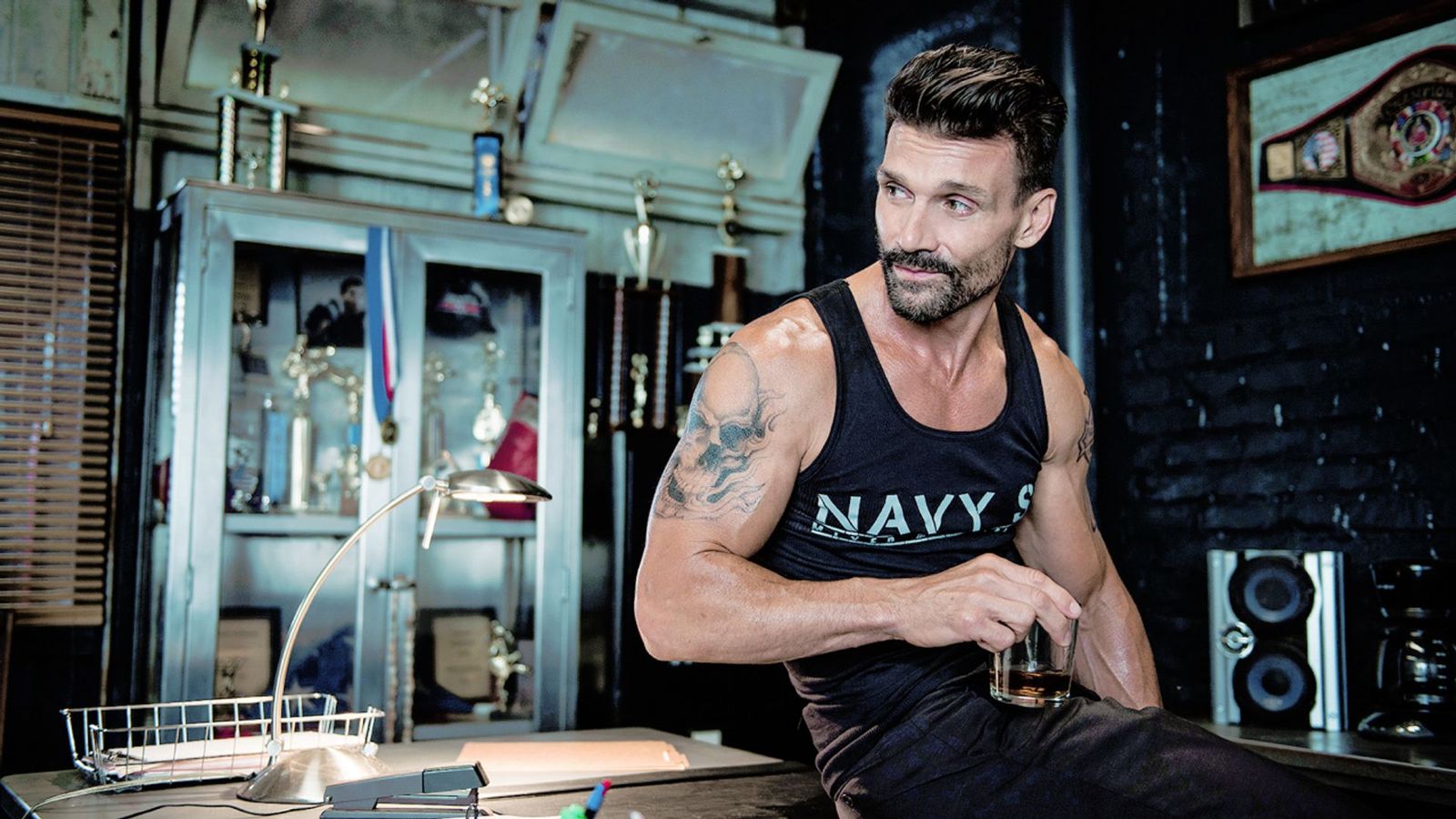 Frank Grillo tattoos: clean color portrait showing the shoulder tattoo and athletic setting