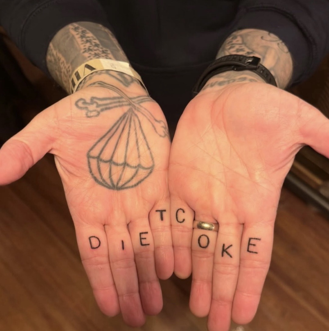 Frank Iero’s palm and finger tattoos