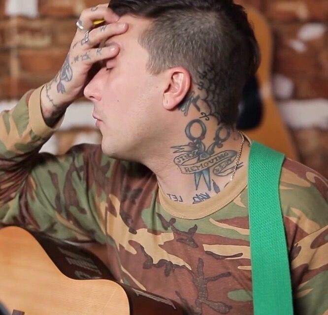 Frank Iero’s scissors and lettering neck tattoos