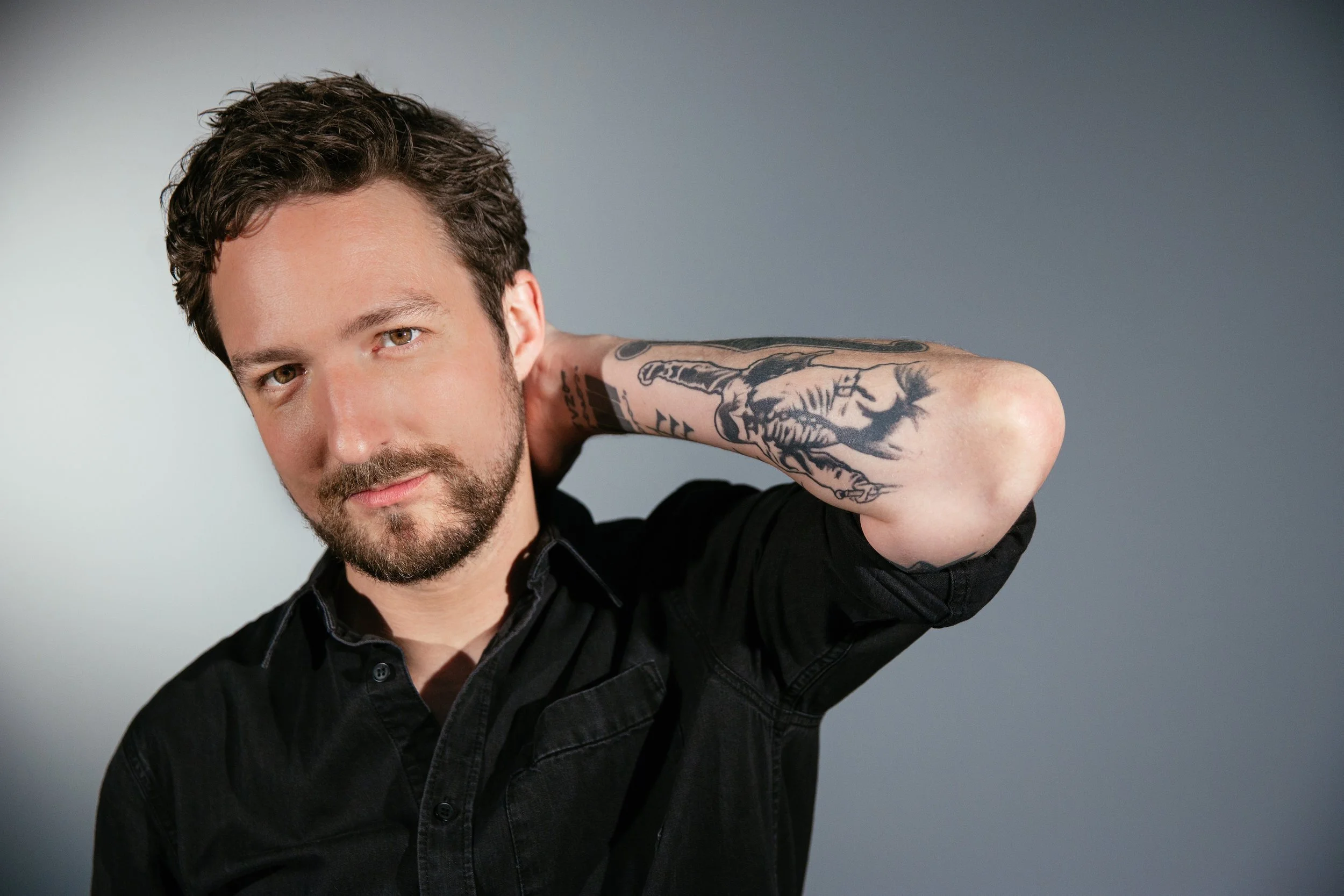 Frank Turner tattoos: Genuine tattoo photograph showing Frank Turner’s raised forearm and sleeve work.