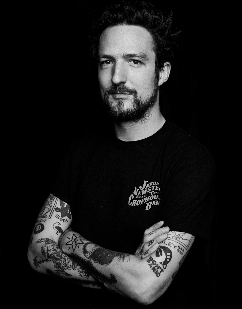 Frank Turner tattoos: Genuine tattoo photograph showing readable arm, wrist and hand designs.