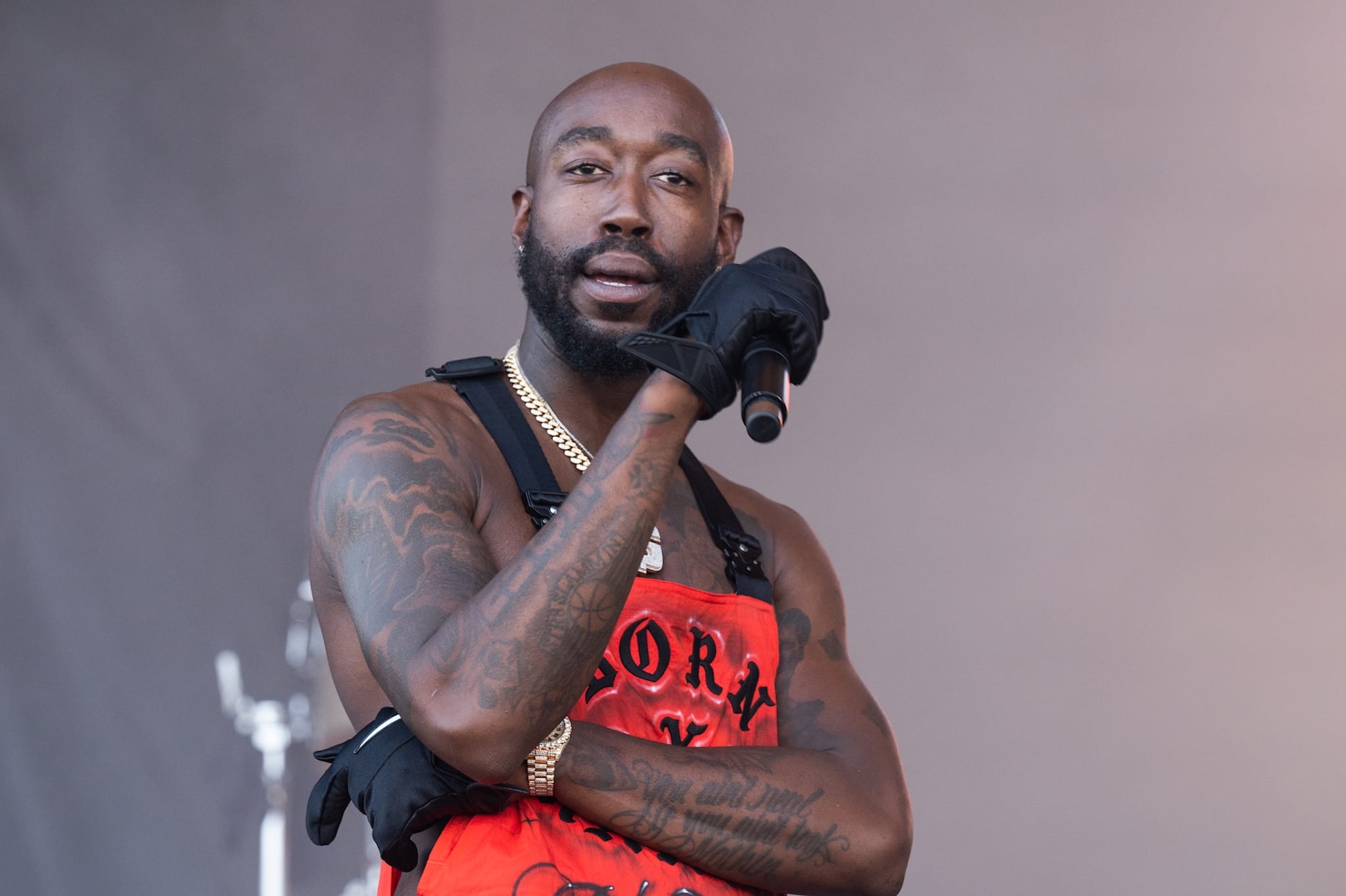 Freddie Gibbs tattooed stage photo