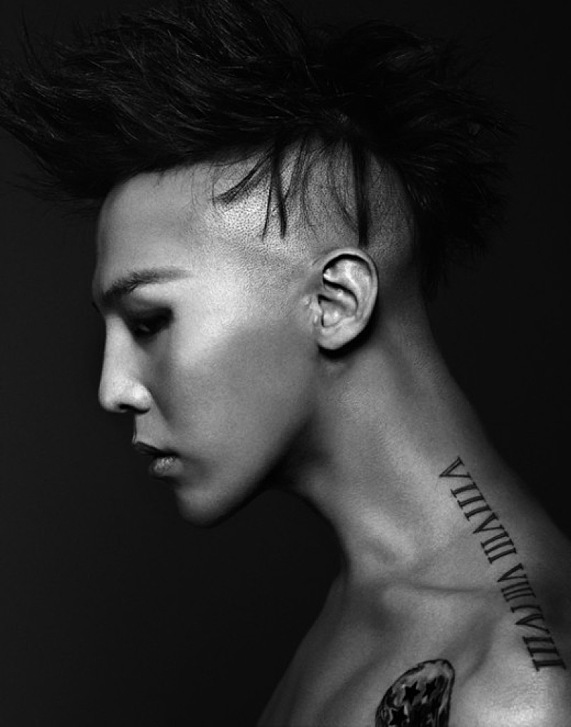 G-Dragon showing his Roman numeral neck tattoo