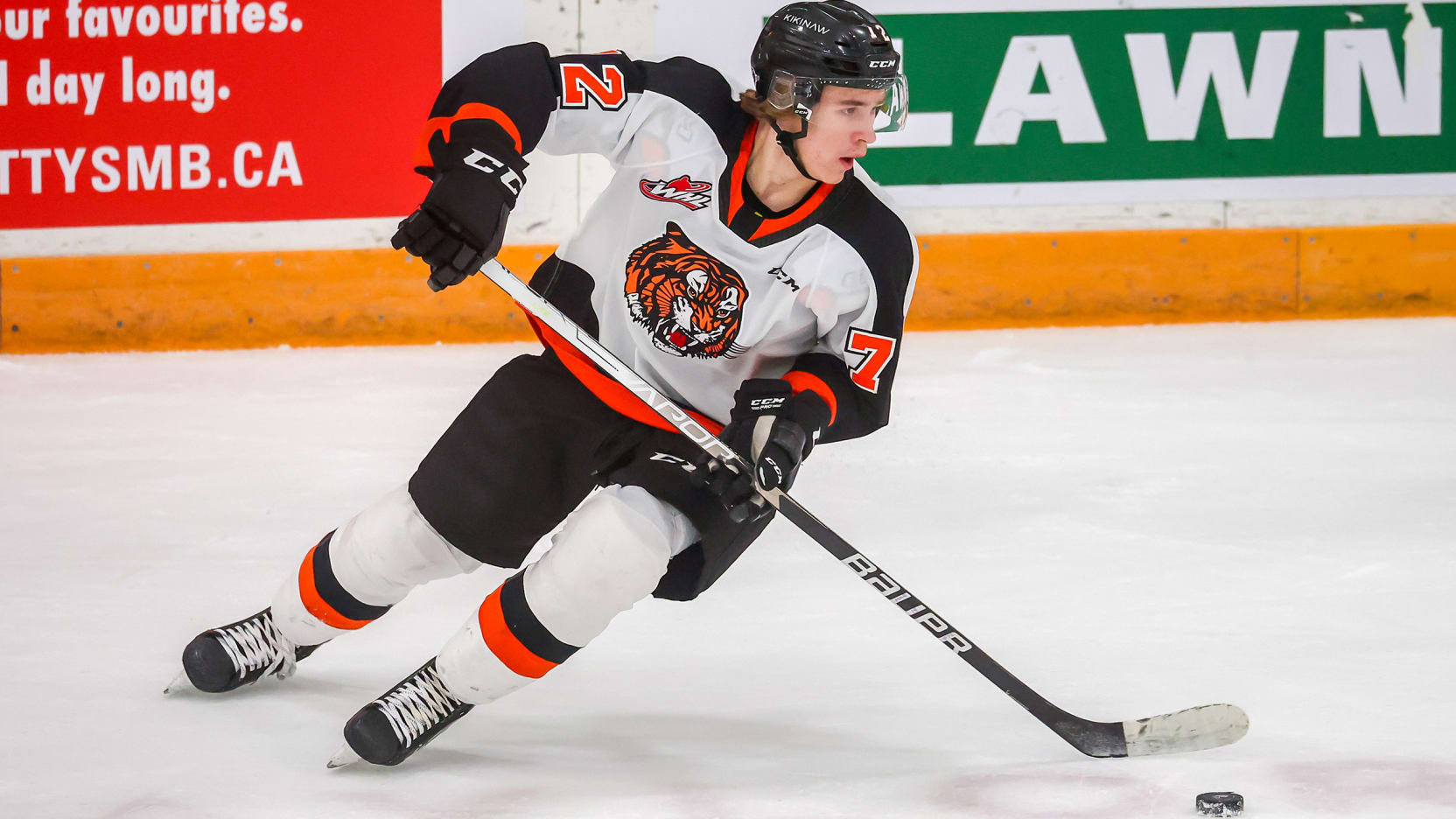 Gavin McKenna in a contextual photograph: Contextual hockey action photograph; not tattoo evidence.; not tattoo evidence