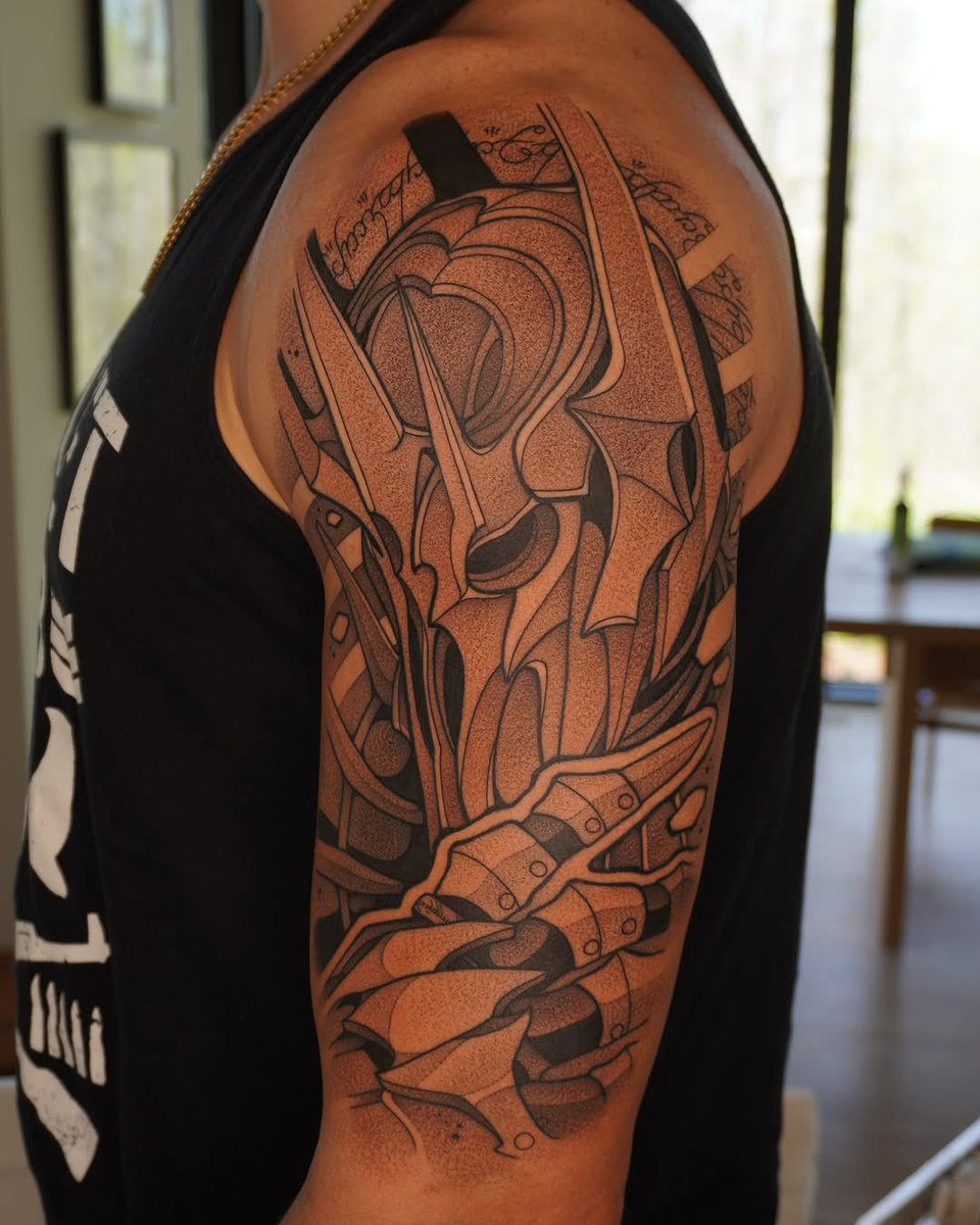 George Kittle tattoos: close photograph of the Sauron figure and shoulder composition
