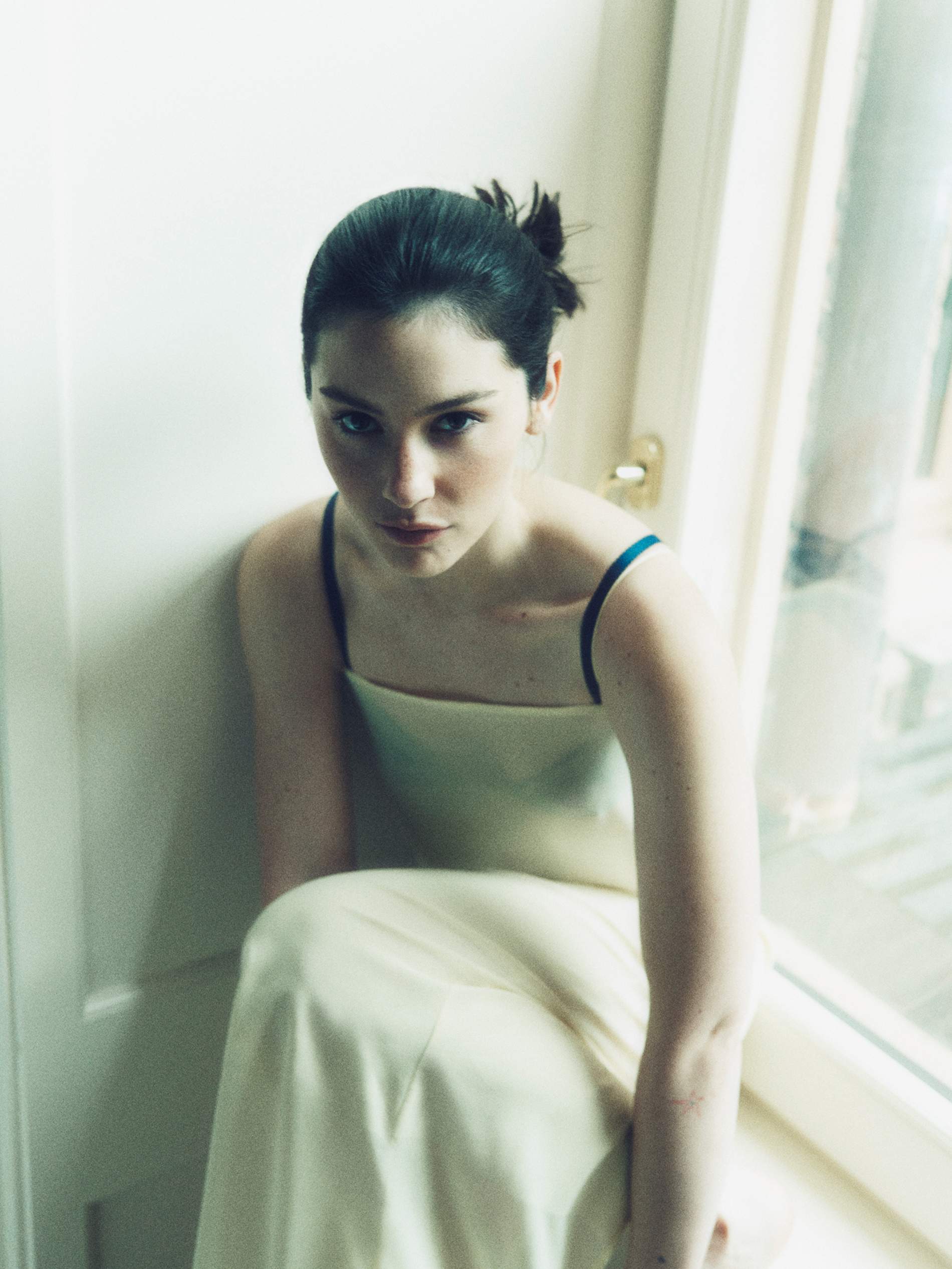 Gracie Abrams in a contextual photograph: Contextual editorial portrait; explicitly not tattoo evidence; not tattoo evidence
