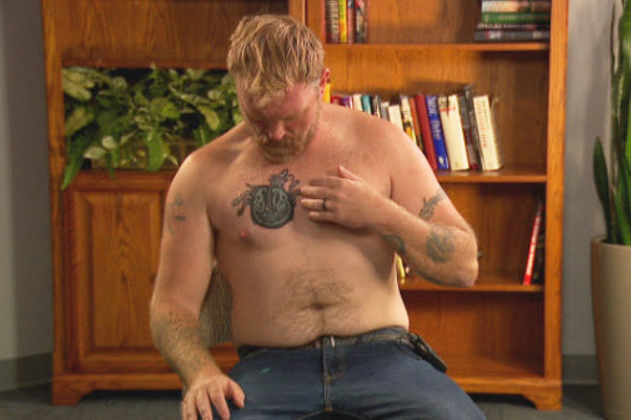 Graham Platner tattoo evidence: Celtic knot and dog-like cover-up tattoo shown during the AP-reported interview.