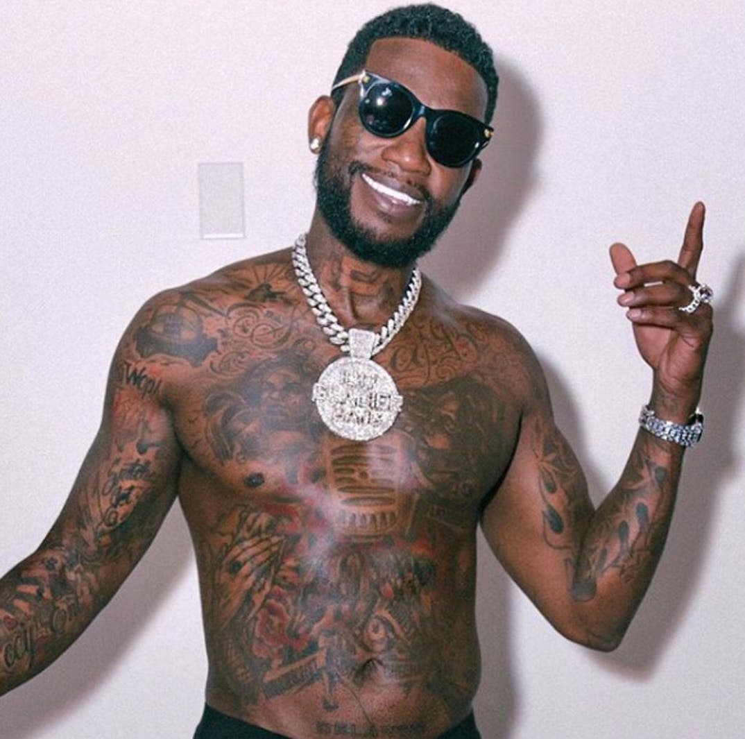 Gucci Mane chest and arm tattoos