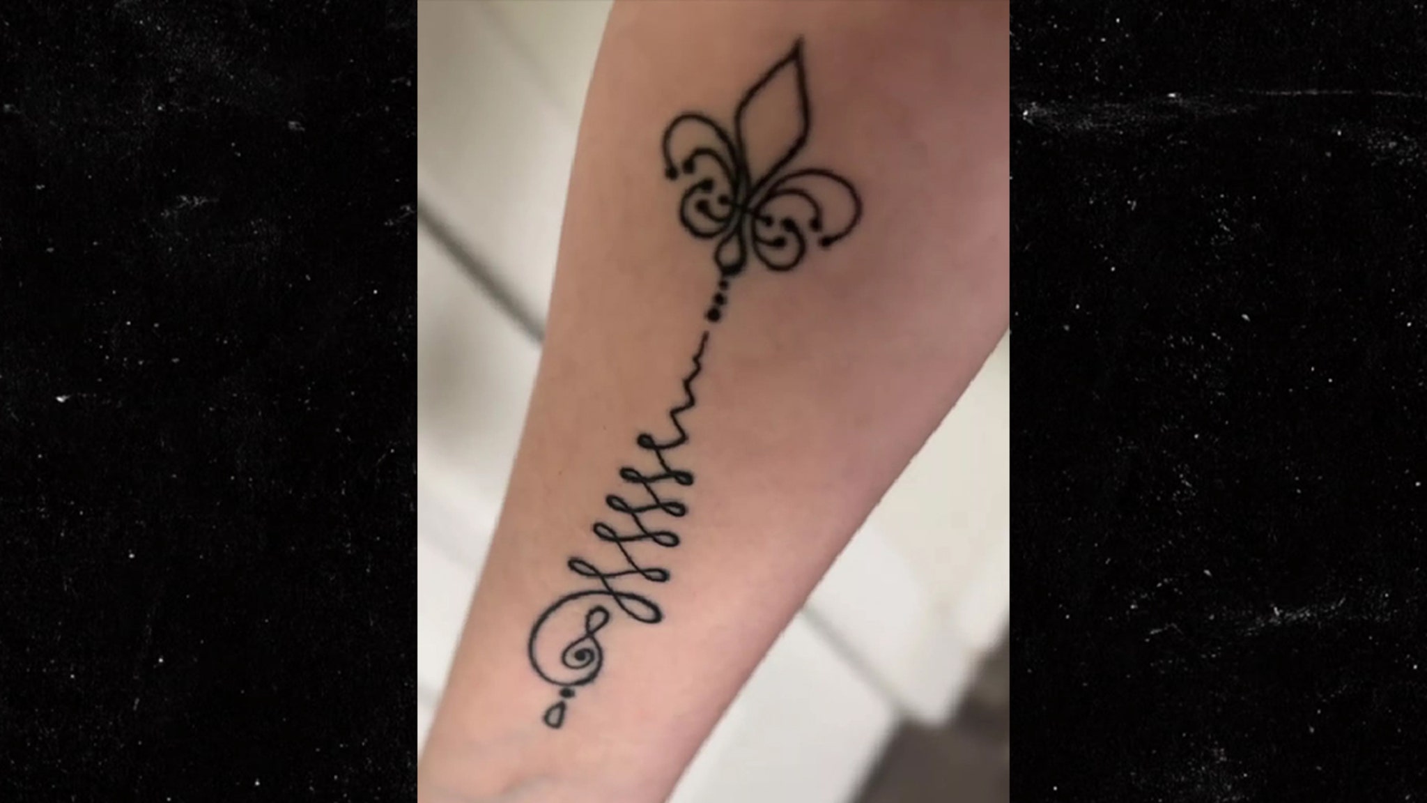 Gypsy Rose Blanchard tattoos: forearm script and flower tattoo