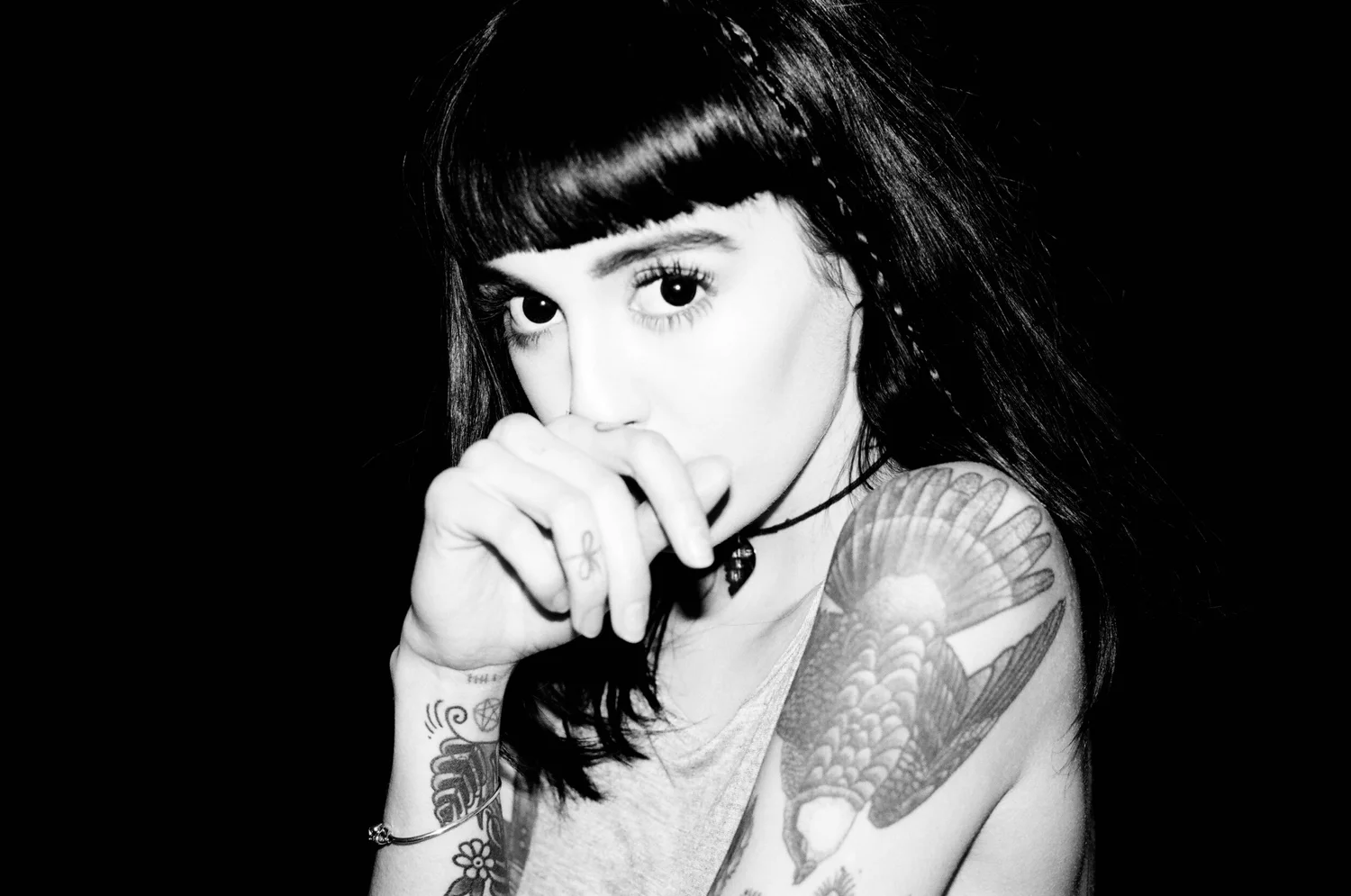 Hannah Snowdon tattoos: black and white shoulder portrait showing upper arm tattoo work
