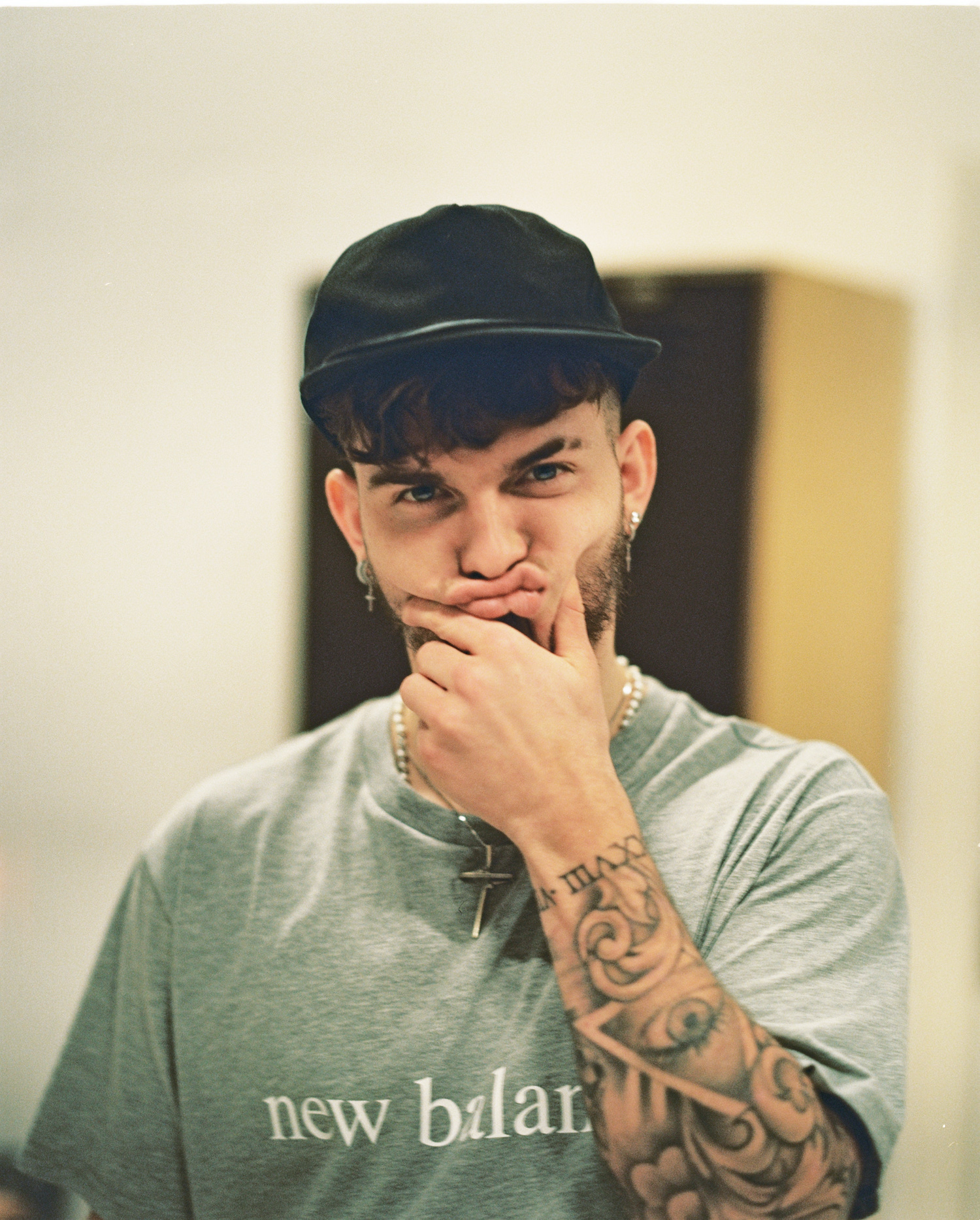 Harvey Elliott tattoos: Editorial close portrait showing Elliott’s tattooed forearm and hand lettering