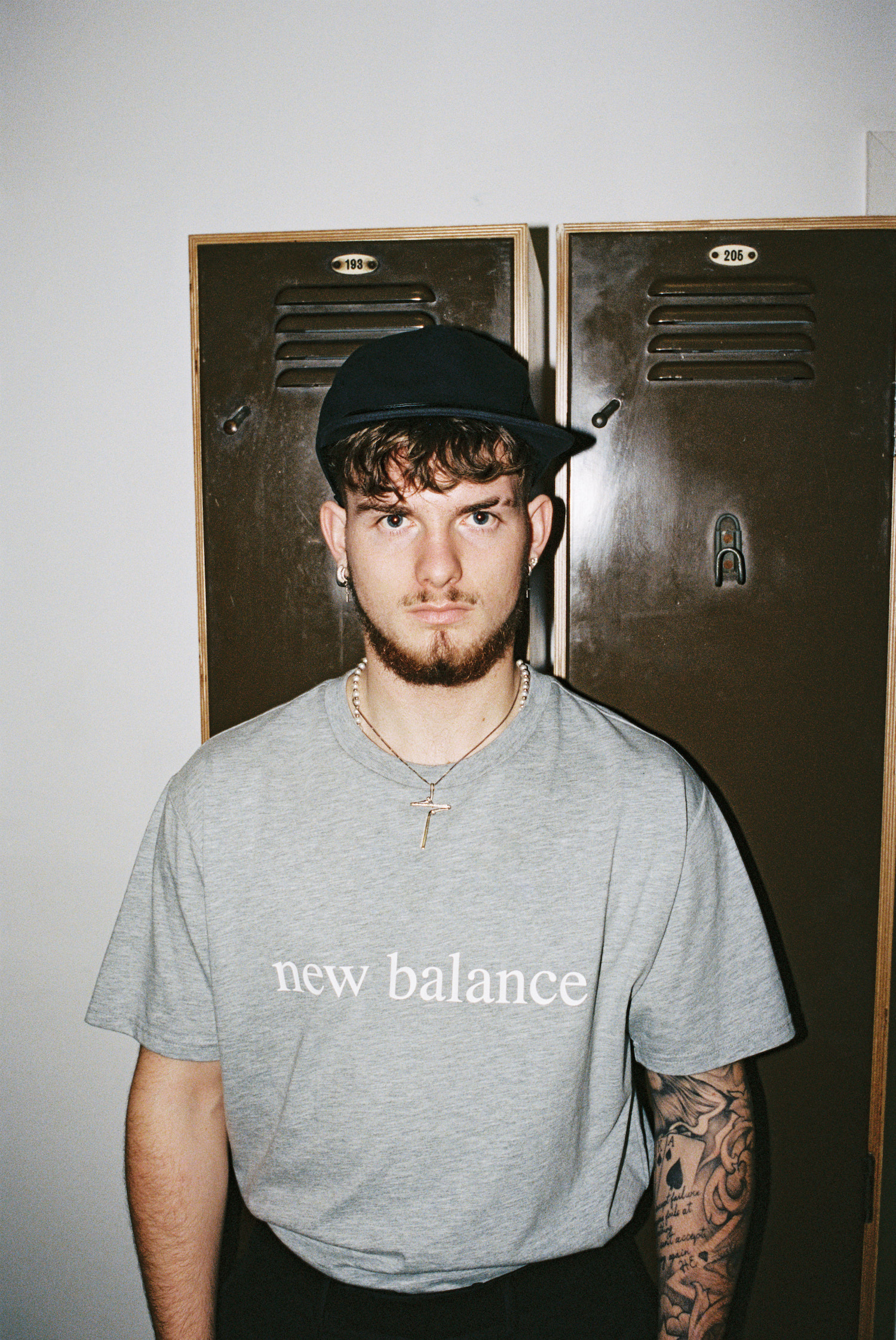 Harvey Elliott tattoos: Editorial portrait showing the full visible tattoo sleeve on Elliott’s arm