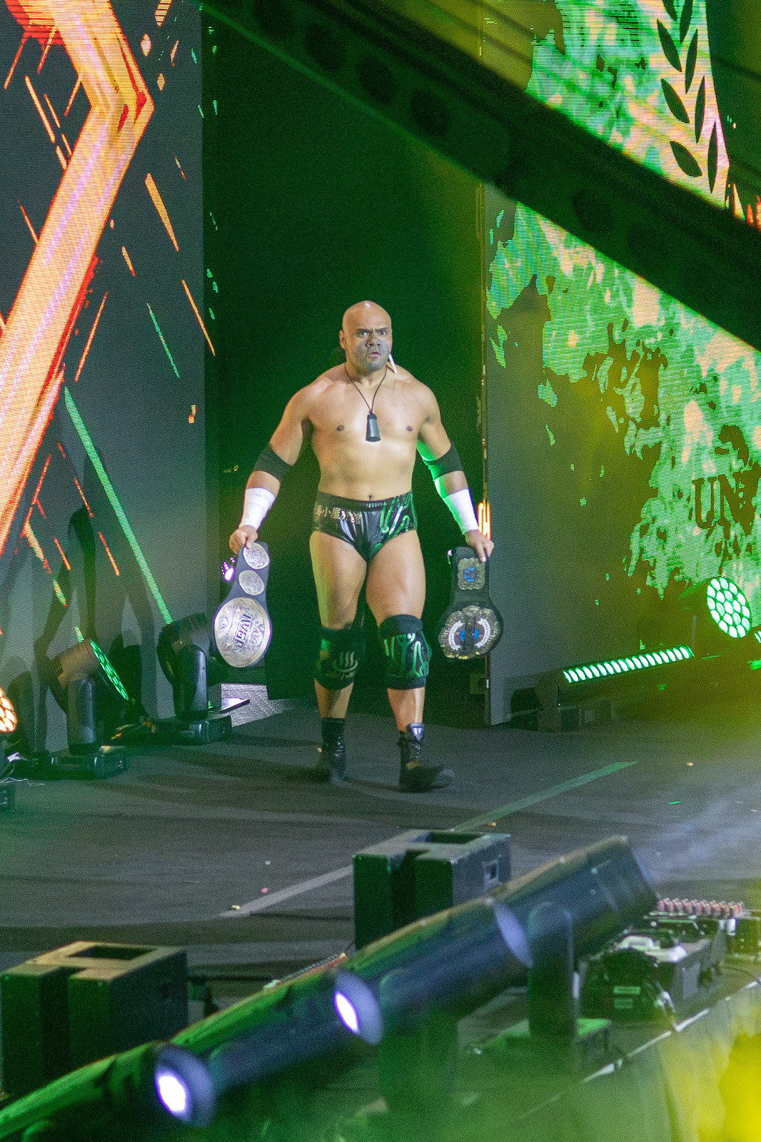 Henare holding championship belts Henare in a contextual photograph: Seeing the whole person; not tattoo evidence