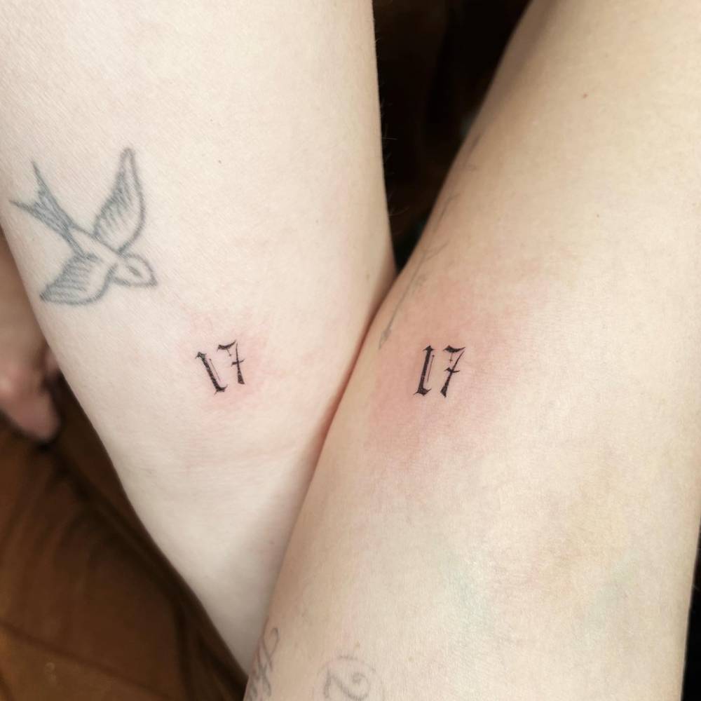 Hilary Duff tattoos: single-needle swallow and paired number tattoos on the inner forearm