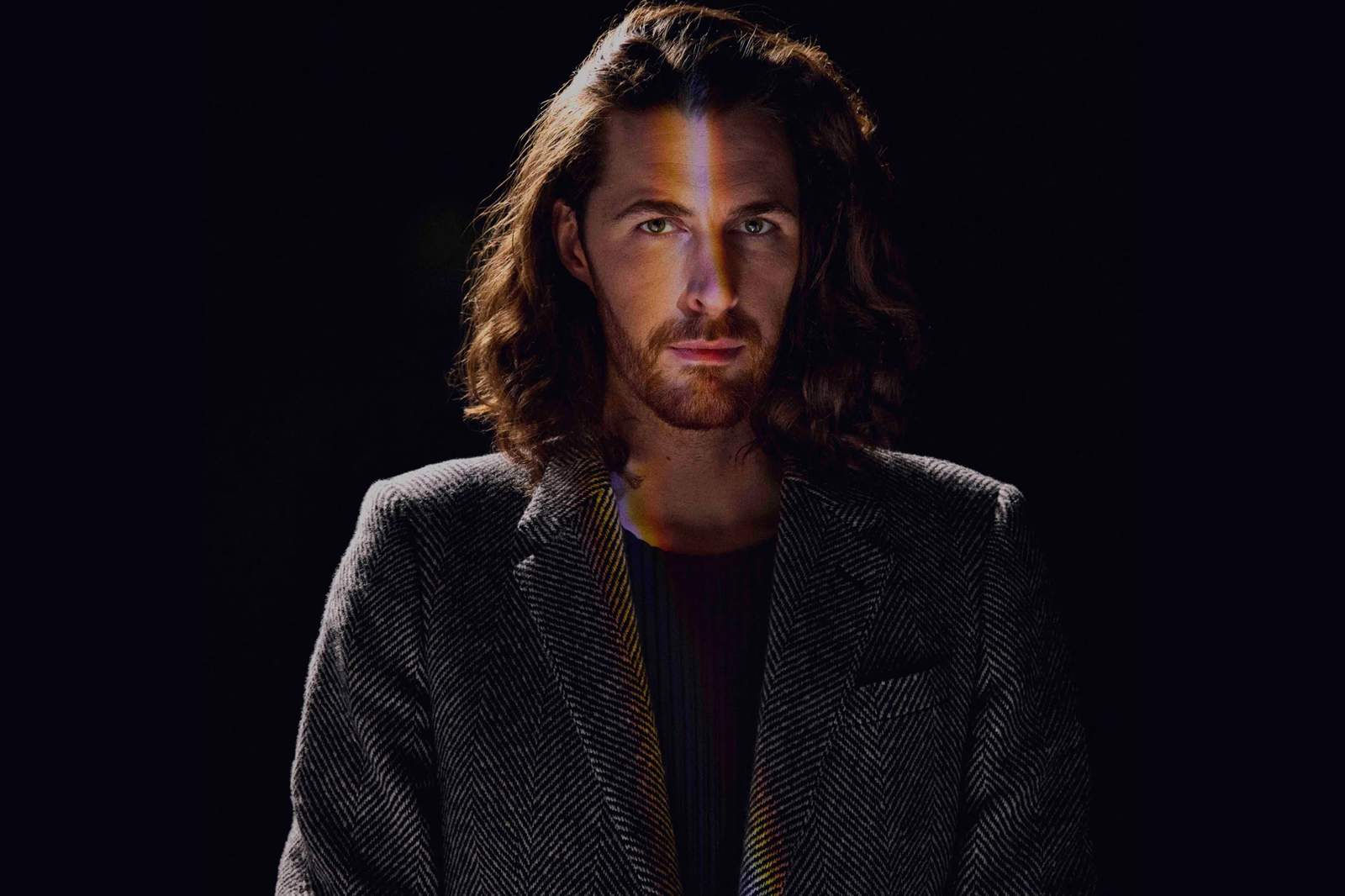 Hozier contextual studio portrait Hozier tattoos: Contextual studio portrait of Hozier; this photograph does not show tattoo evidence