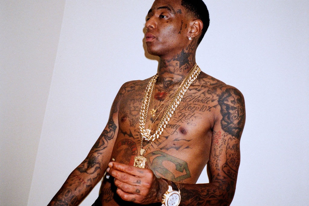 Soulja Boy tattoos: clear shirtless portrait showing chest lettering, arm coverage, and layered jewelry