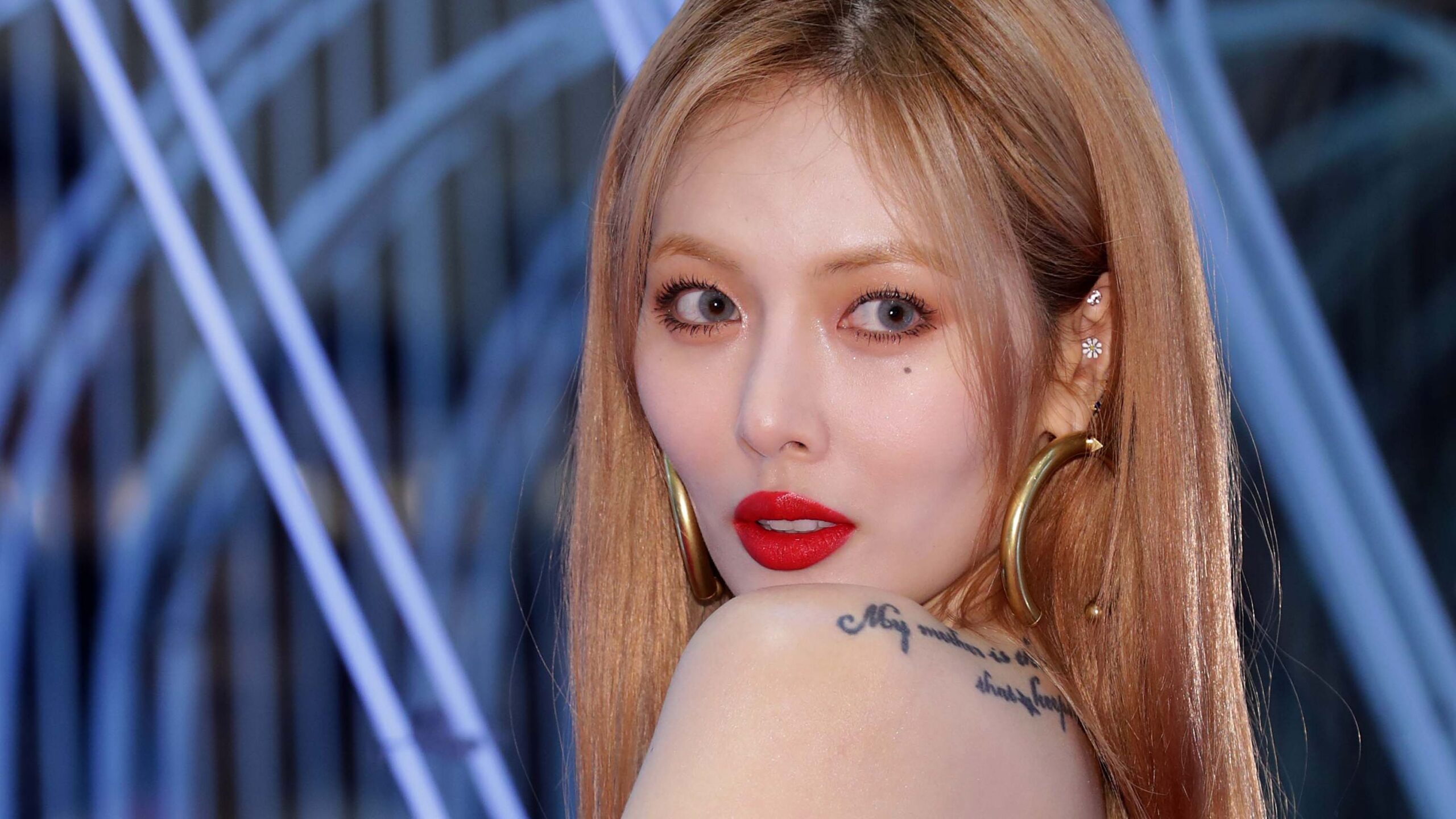 HyunA tattoos: shoulder script close editorial portrait
