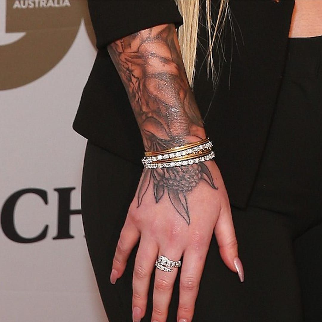 Iggy Azalea tattoos: Floral sleeve and hand tattoos
