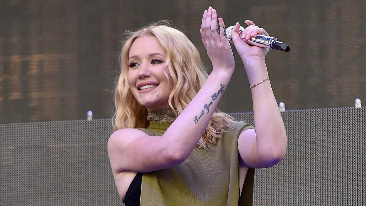 Iggy Azalea tattoos: Trust Your Struggle forearm tattoo