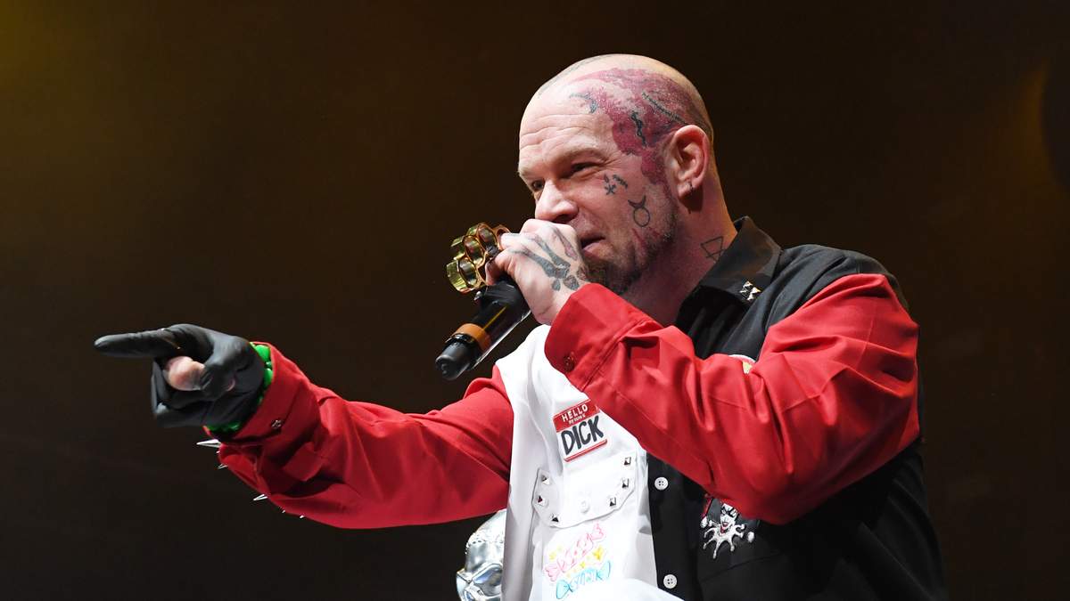Ivan Moody Misfits hand tattoo and arm ink