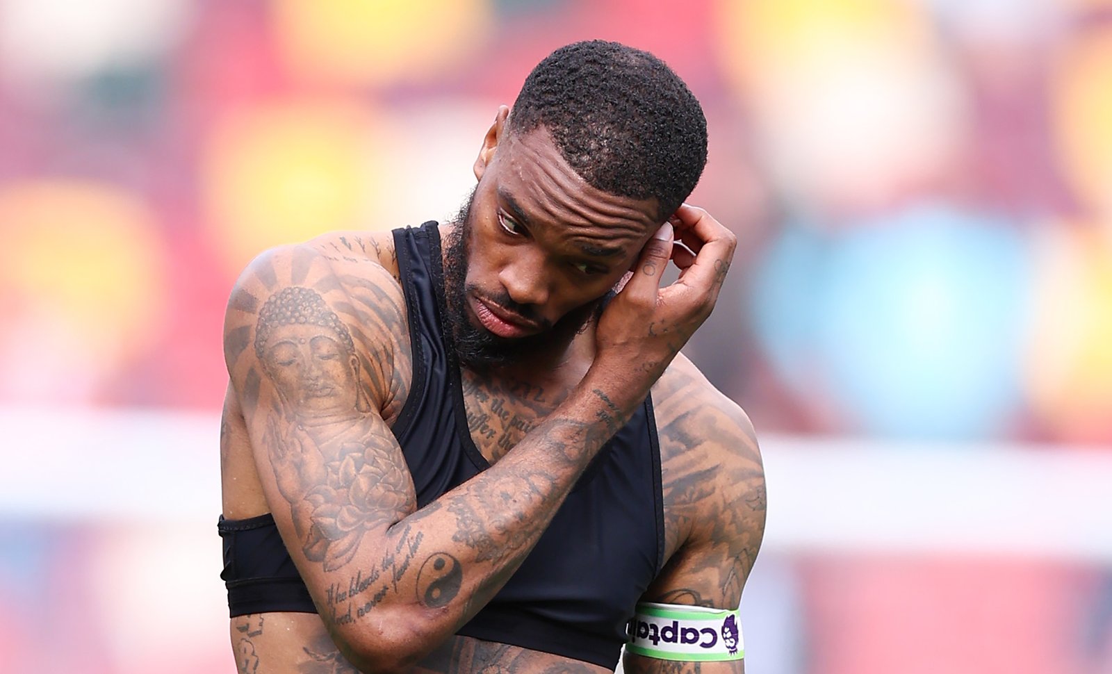 Ivan Toney tattoos: Match-action image documenting visible arm ink without assigning names to indistinct motifs