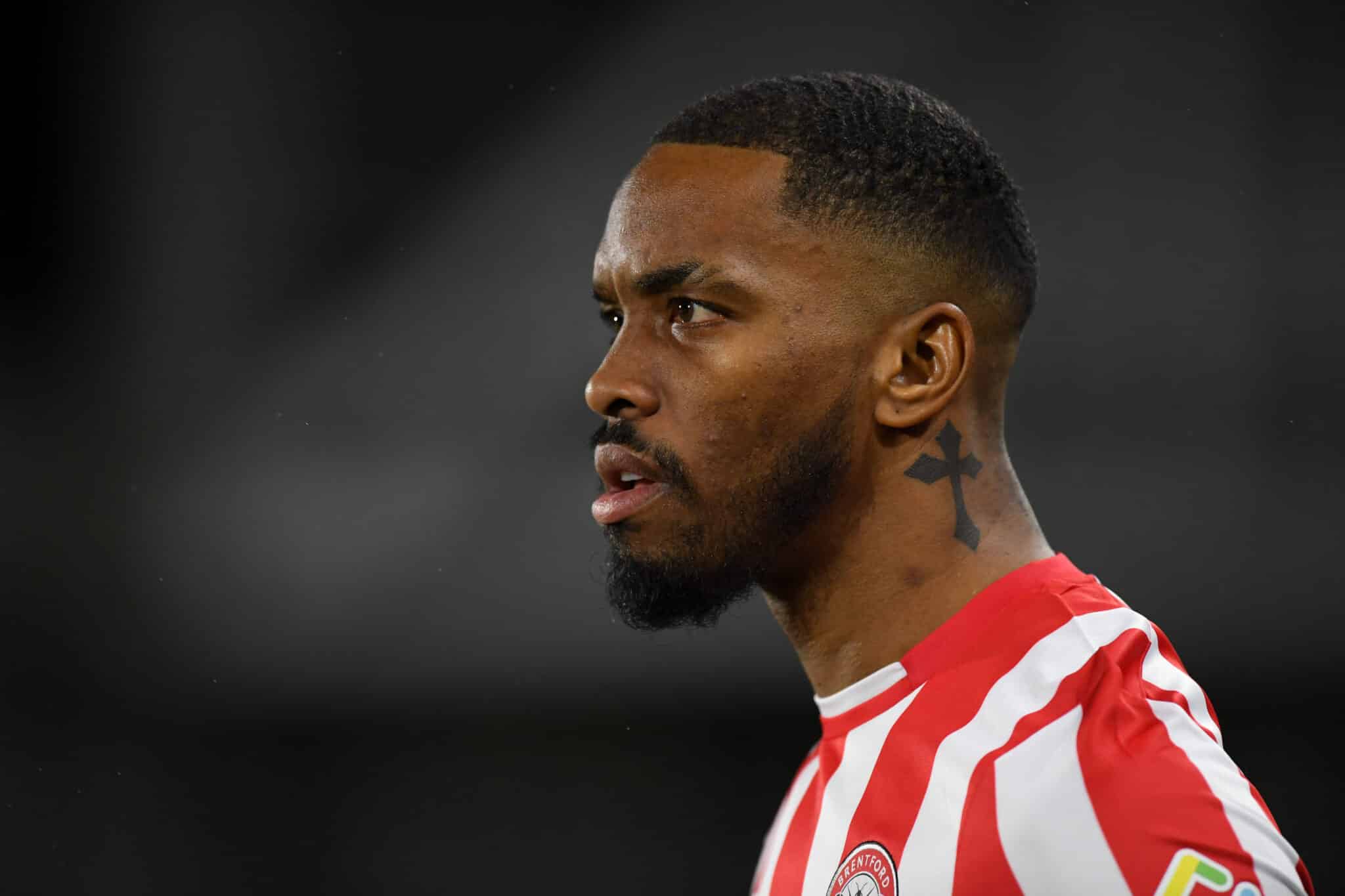 Ivan Toney tattoos: Close side profile showing the neck tattoo from a separate photograph