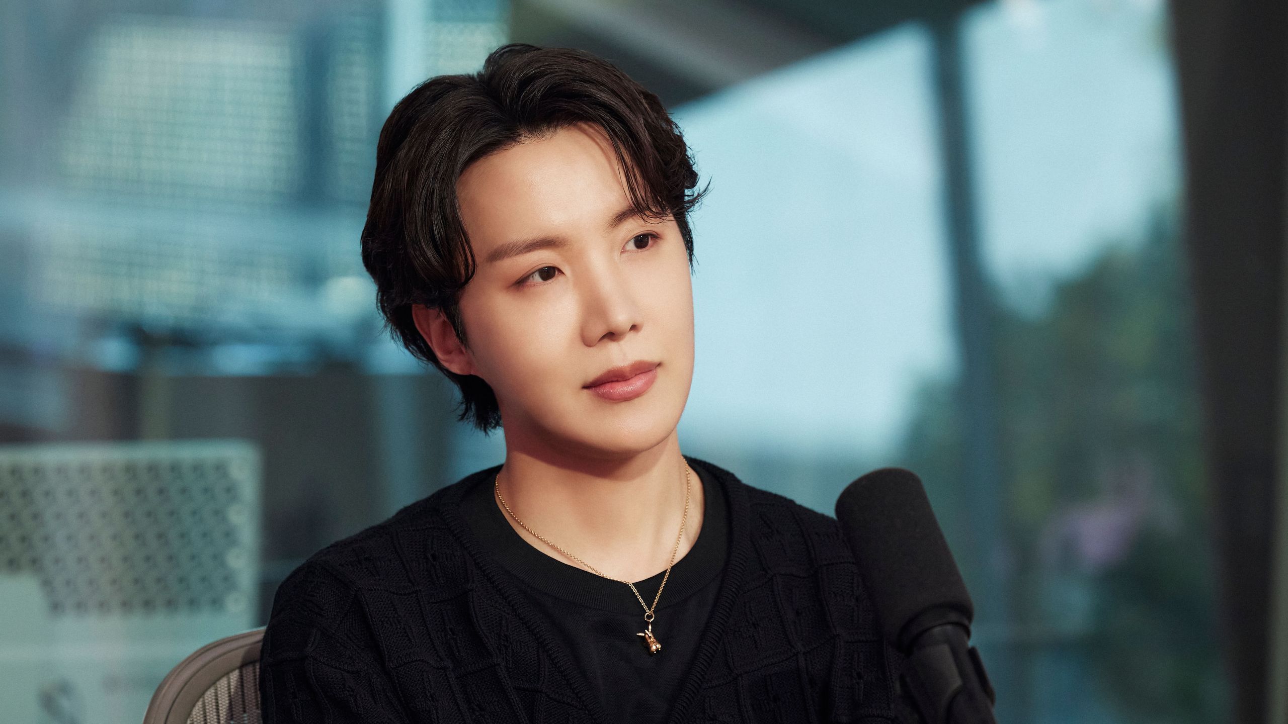 J-Hope in a contextual photograph: studio interview portrait; contextual photograph, not tattoo evidence; not tattoo evidence