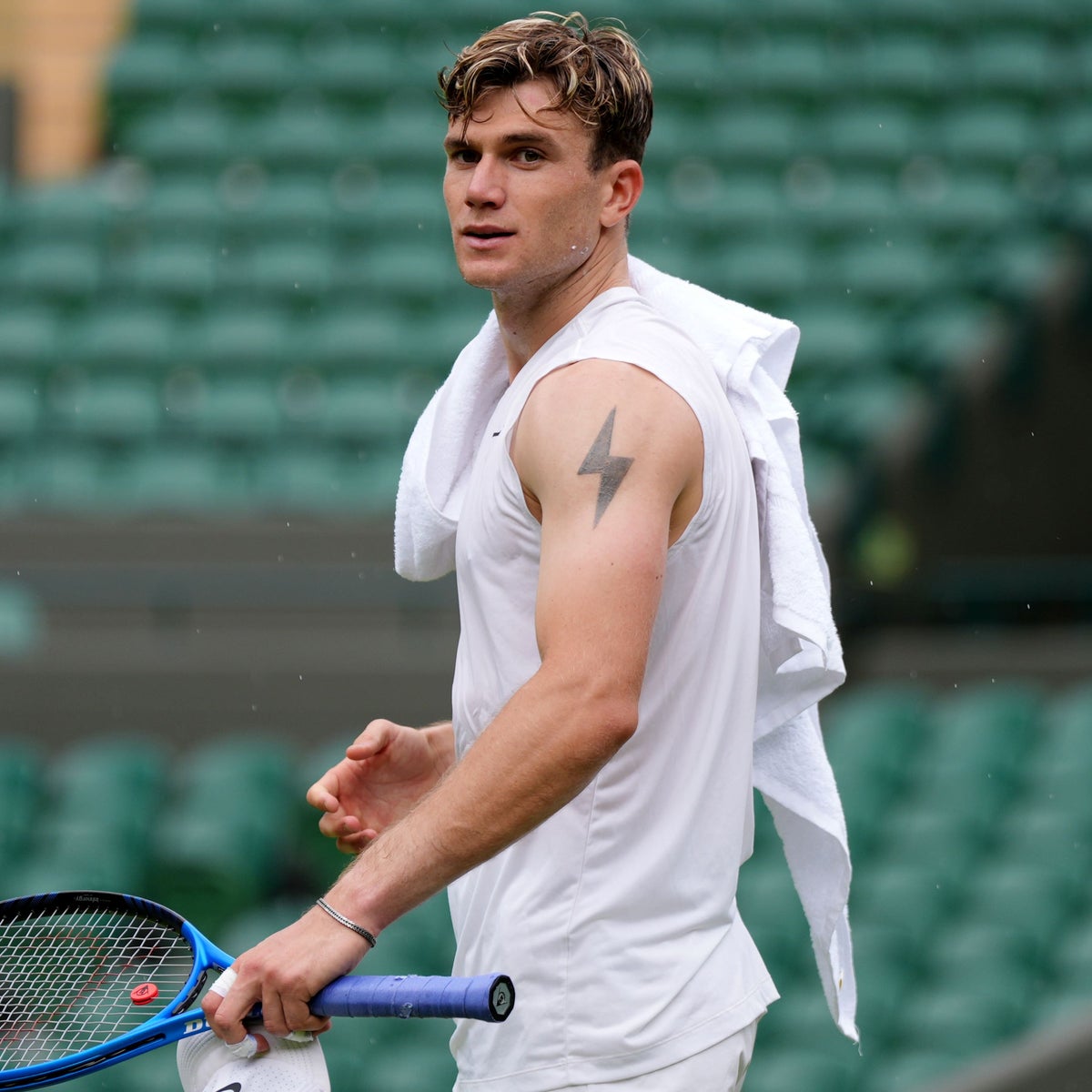 Jack Draper tattoos: Genuine tattoo photograph showing Draper's face and the complete lightning-bolt upper-arm tattoo.