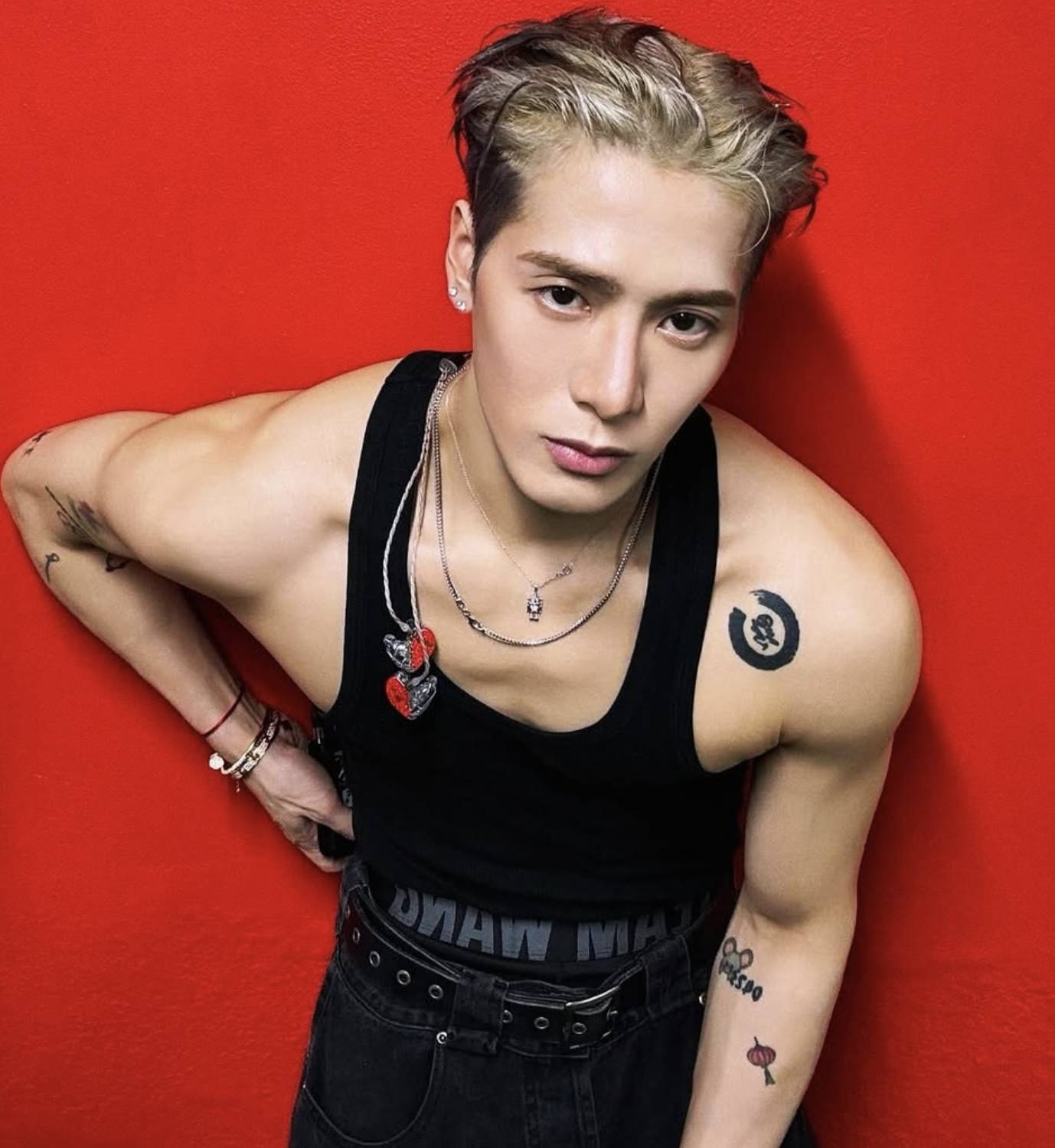 Jackson Wang tattoos: shoulder character and arm ink Jackson Wang tattoos: Jackson Wang shoulder and arm tattoos