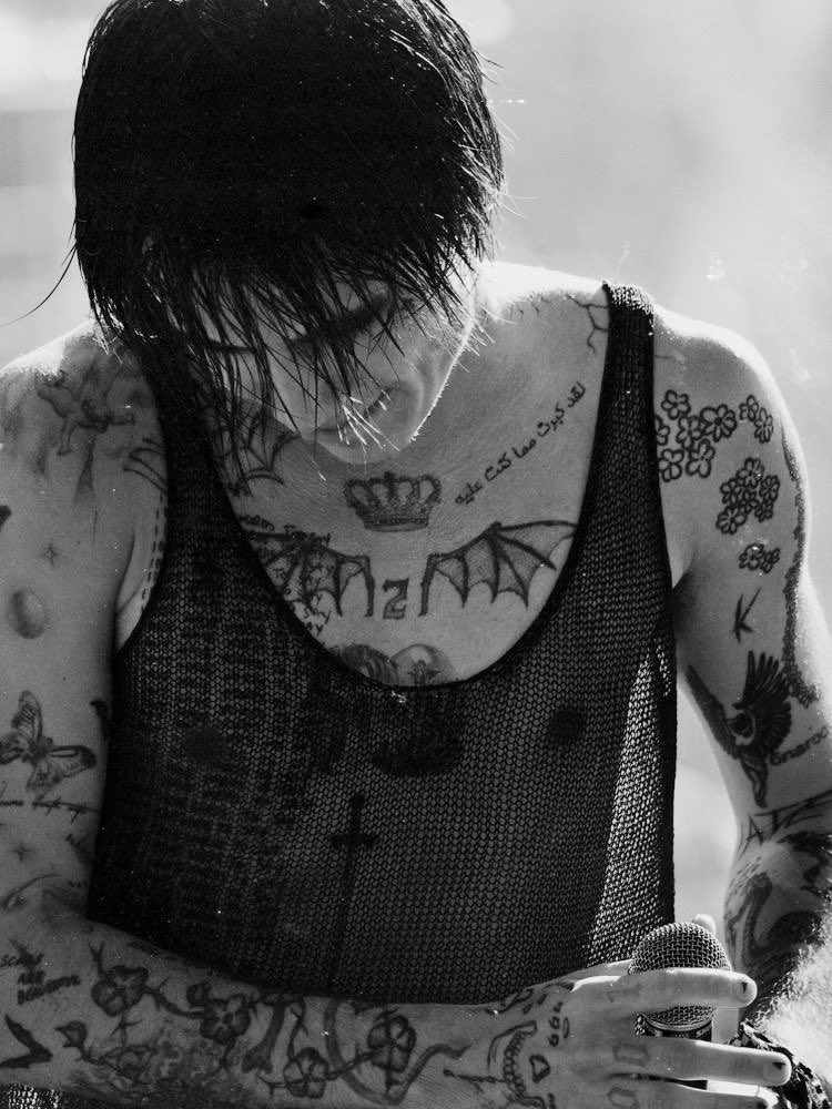 Jaden Hossler showing his black and white stage tattoos