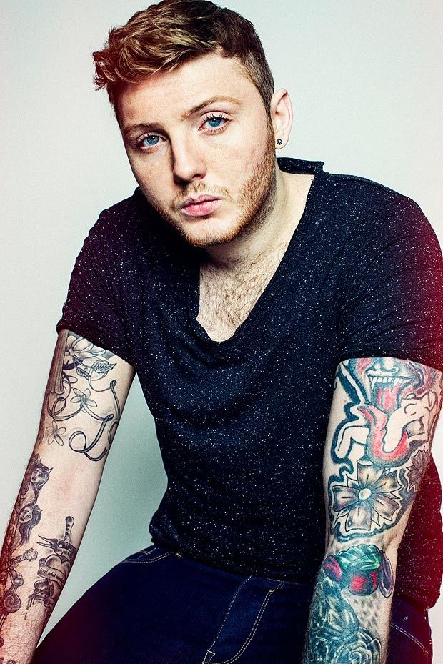 James Arthur tattoos: both forearms with colourful flowers, bold outlines and bright sleeve panels