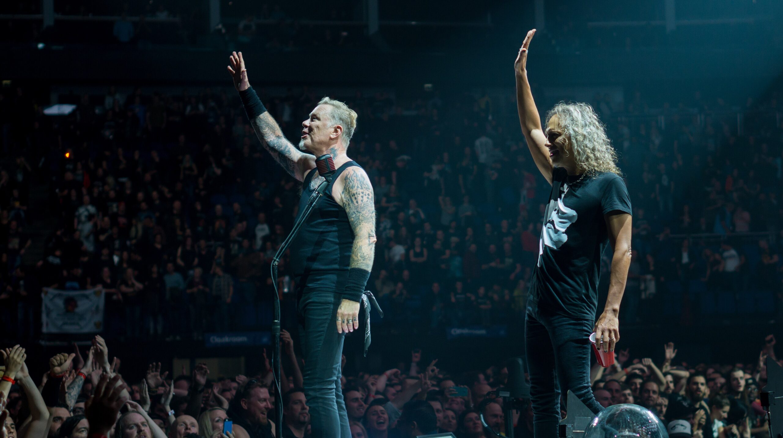 James Hetfield's dense arm sleeve tattoos during a Metallica performance