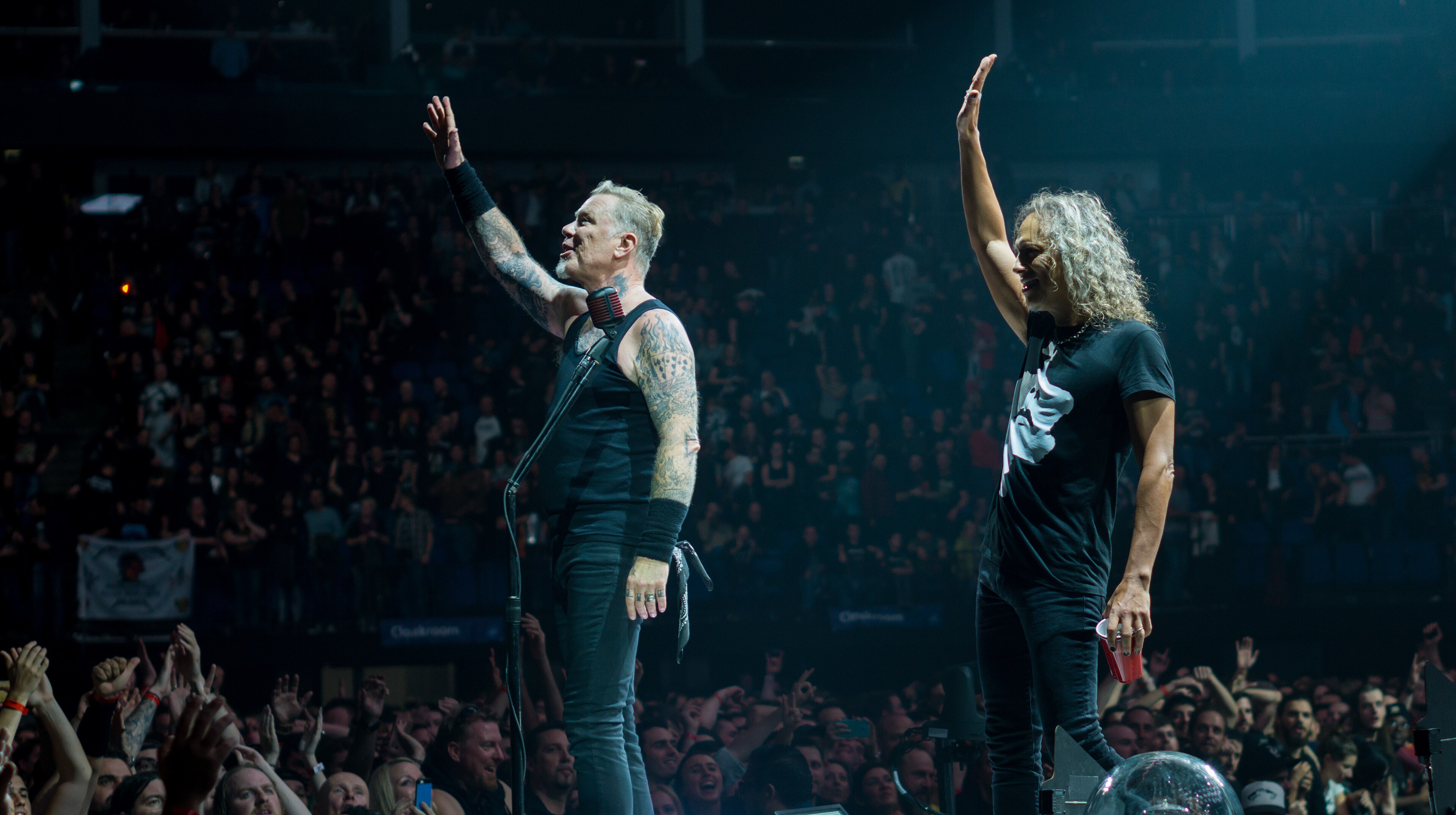 James Hetfield's dense arm sleeve tattoos during a Metallica performance