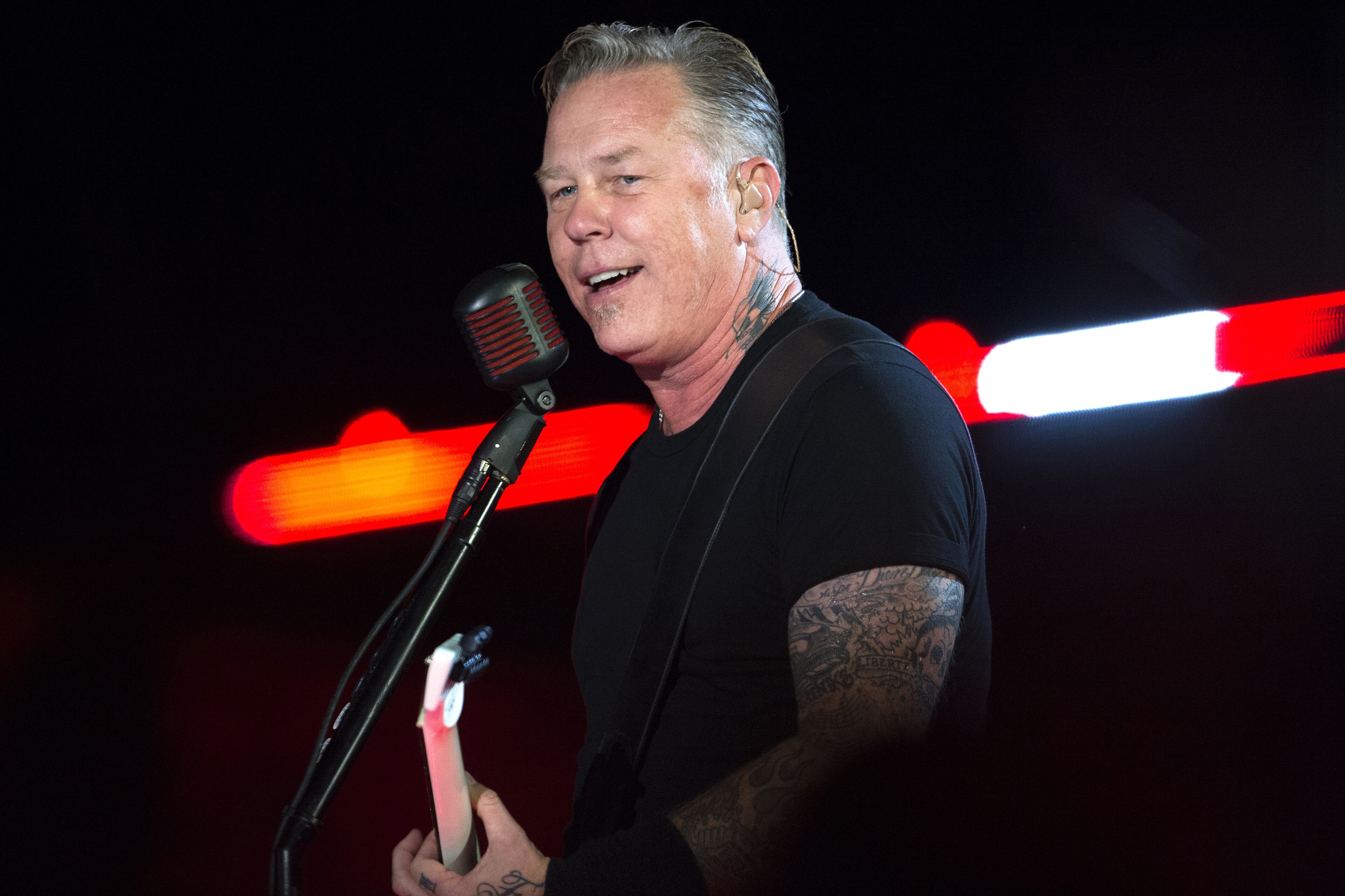 James Hetfield with visible neck, arm and hand tattoos