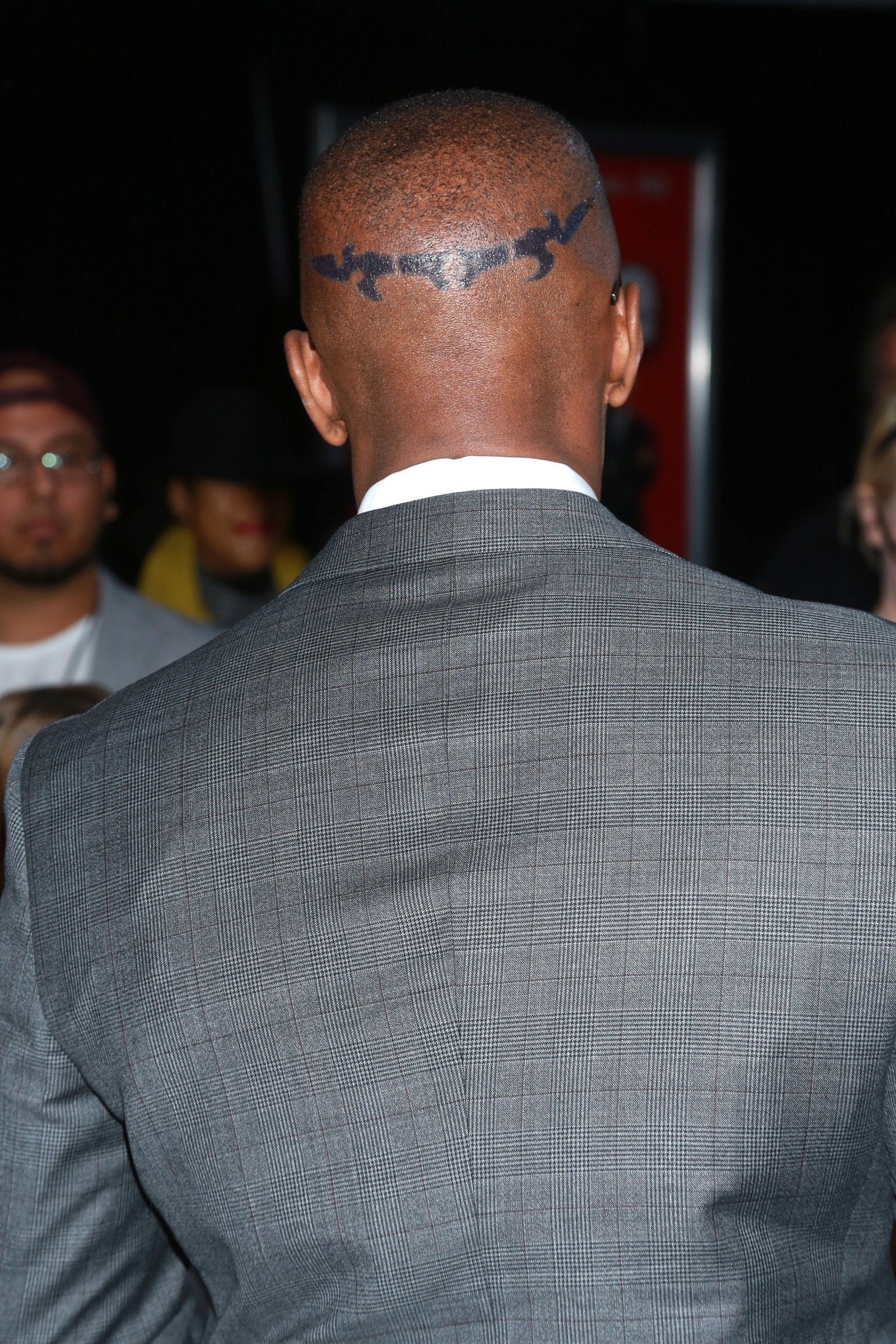 Jamie Foxx tattoos: rear event photograph showing the continuous black head band from behind