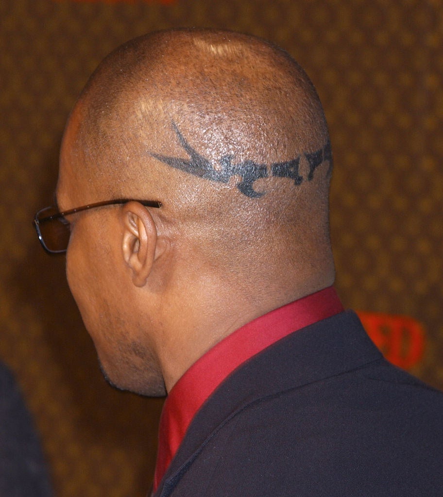 Jamie Foxx tattoos: separate event photograph showing the head tattoo’s visibility as Foxx turns away