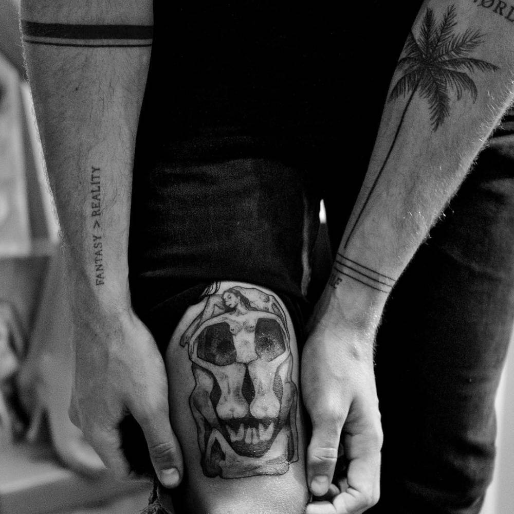 Jay Alvarrez In Voluptas Mors inspired skull thigh tattoo