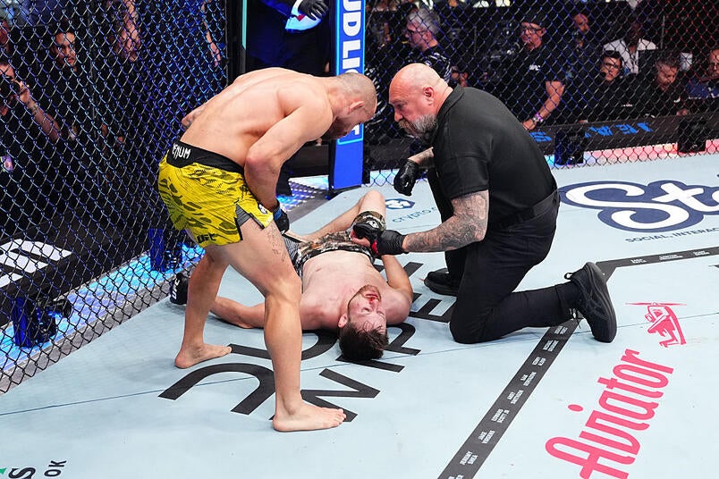 Jean Silva in a contextual photograph: Distinct fight-context photograph, contextual only and not tattoo evidence; not tattoo evidence
