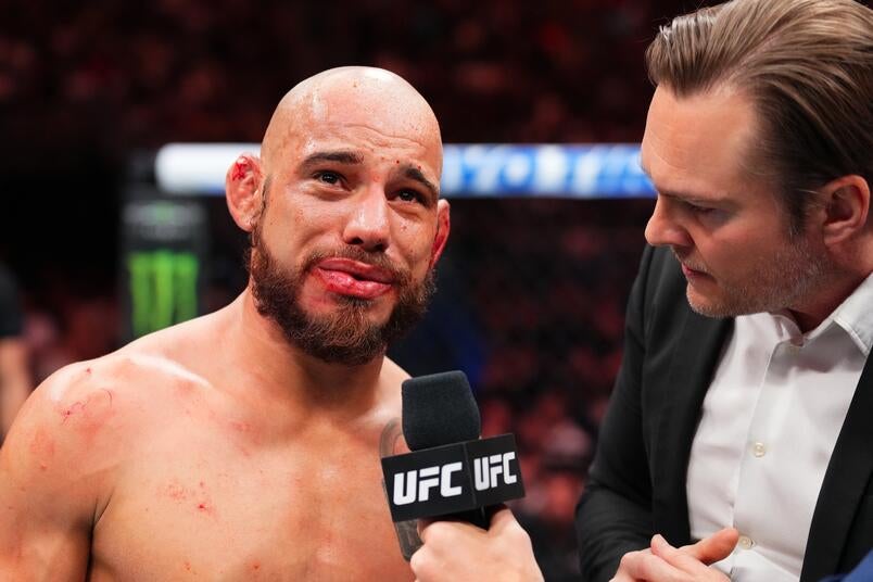 Jean Silva in a contextual photograph: Distinct post-fight interview photograph, contextual only and not tattoo evidence; not tattoo evidence