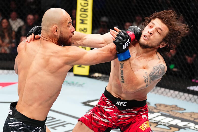 Jean Silva in a contextual photograph: Distinct punch photograph, contextual only and not tattoo evidence; not tattoo evidence