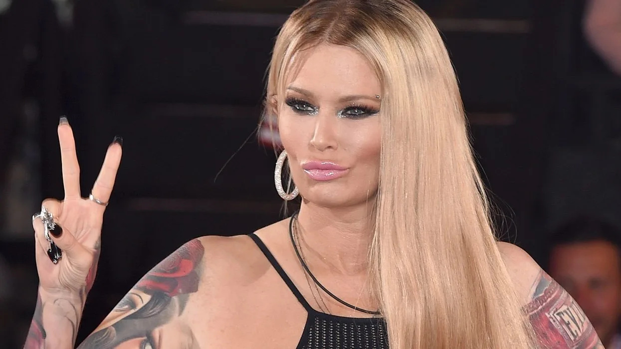 Jenna Jameson tattoos: both colorful sleeves and hand details in a clear evening portrait