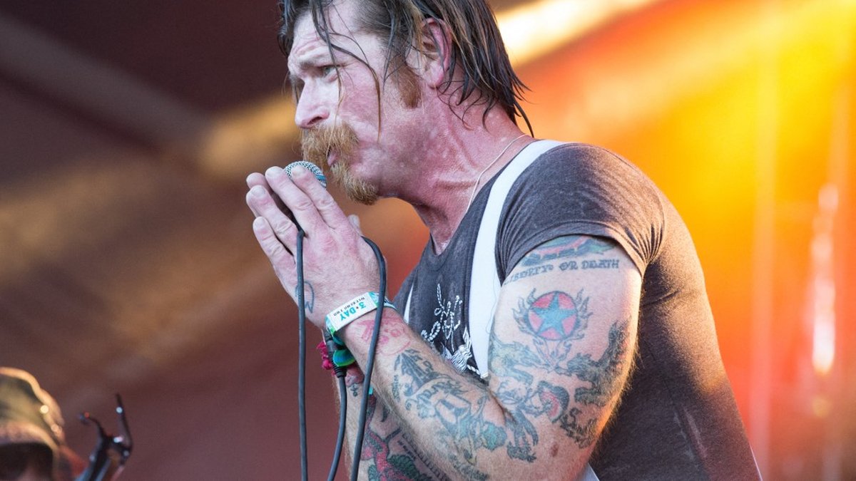 Jesse Hughes arm tattoos including Liberty or Death lettering