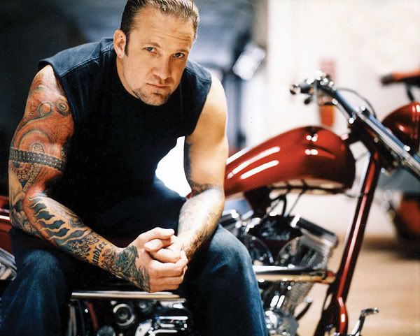 Jesse James tattooed arm in the workshop