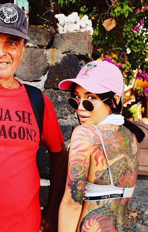 Jhene Aiko rising sun shoulder tattoo