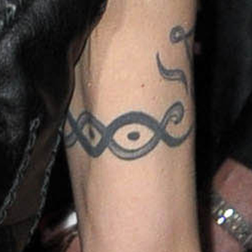 Joan Jett tattoos: Joan Jett tattoo evidence for the section Joan Jett's looping upper-arm armband